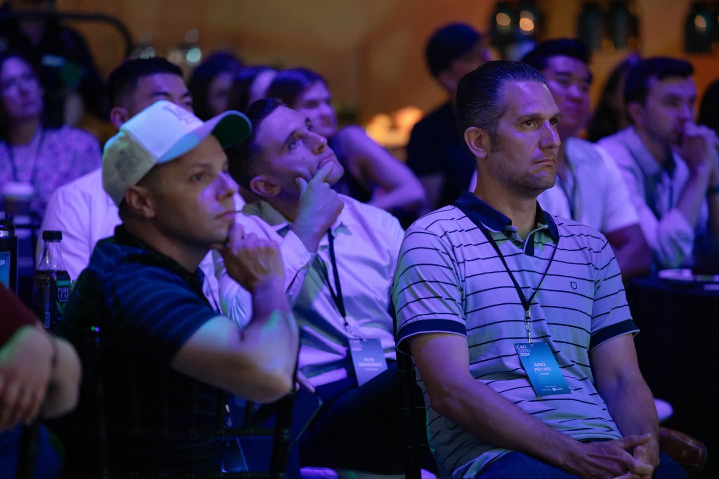 Buyers watching a presentation from the audience